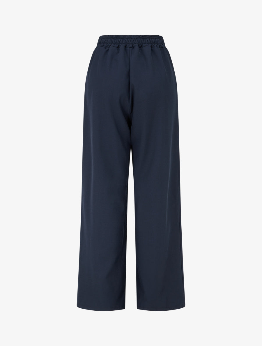 Fließende Hose mit hoher Taille und Schmuck