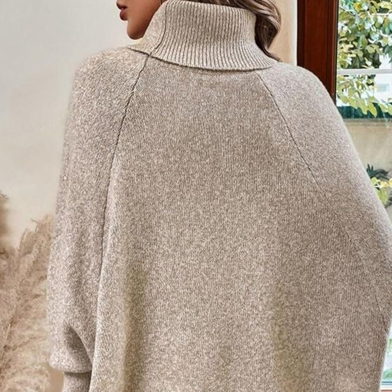 Eleganter Pullover-Poncho für Damen mit Rollkragen und asymmetrischem Saum